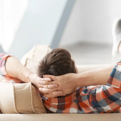 Man lounging on couch